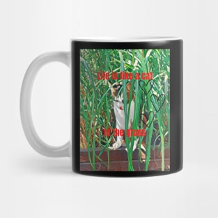 Life is like a cat in the grass Mug